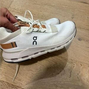 On Running White and Brown Athletic Shoes
